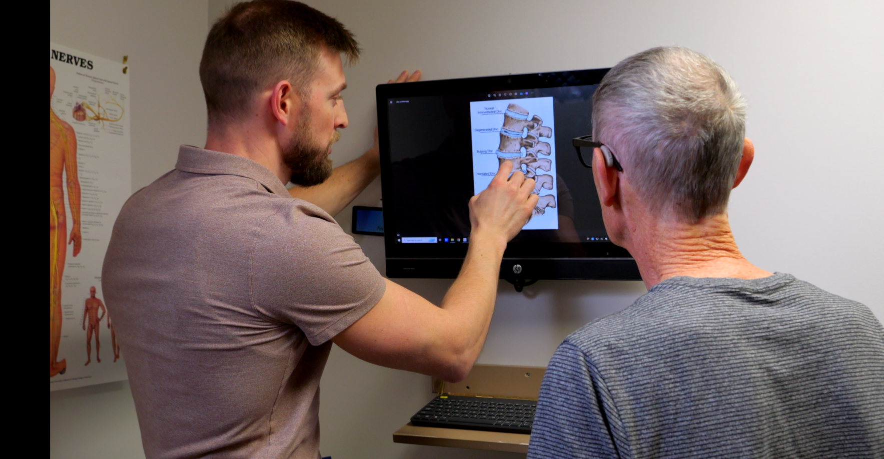 explaining low back with photo assessment Riverside Chiropractic London Chiropractor Helps Low Back Pain